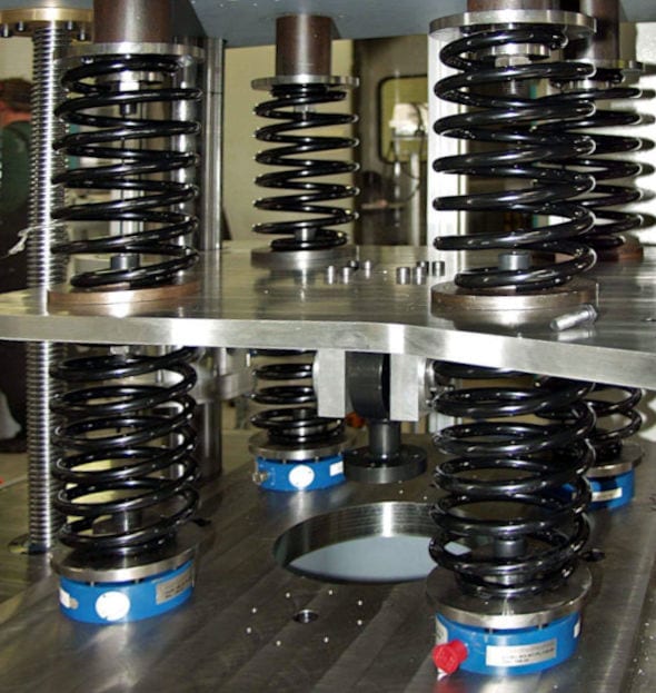 A system for testing multiple springs simultaneously.