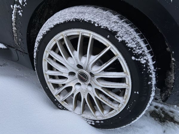 A car tire in the snow